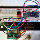 Breadboard, L to R: audio jack breakout, level shifter, Arduino. Below: audio chip breakout on protoboard